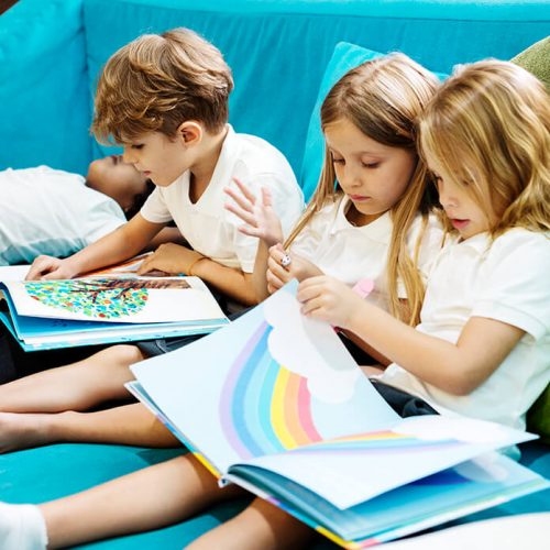 group-of-diverse-young-students-reading-children-s-PEXS9MS.jpg