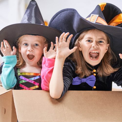 laughing-children-in-witches-costumes-EYP3CB7.jpg